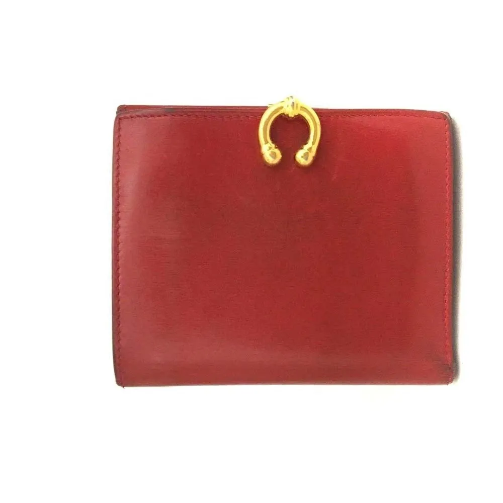 Gucci, red leather, bi-fold style, wallet with multiple pockets, tons of card slots, & a gold, engraved 'GUCCI' horseshoe accent