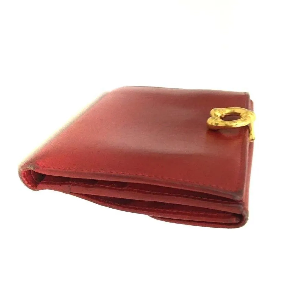 Gucci, red leather, bi-fold style, wallet with multiple pockets, tons of card slots, & a gold, engraved 'GUCCI' horseshoe accent